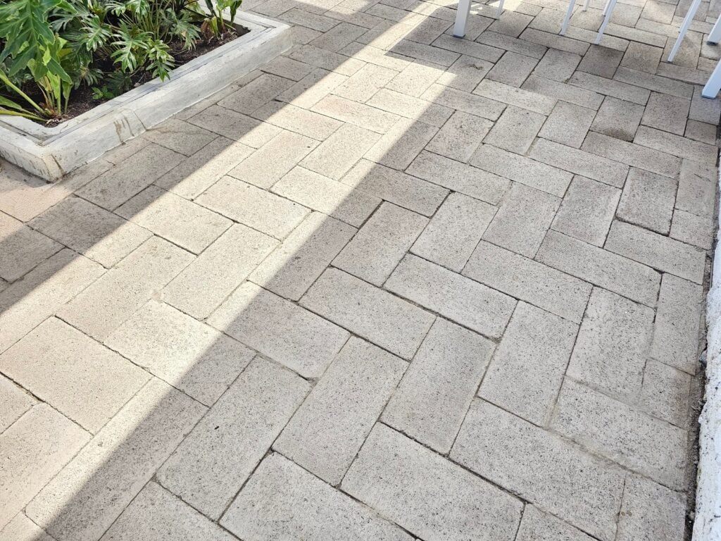 Skilled contractor laying masonry patio paving stones in DC