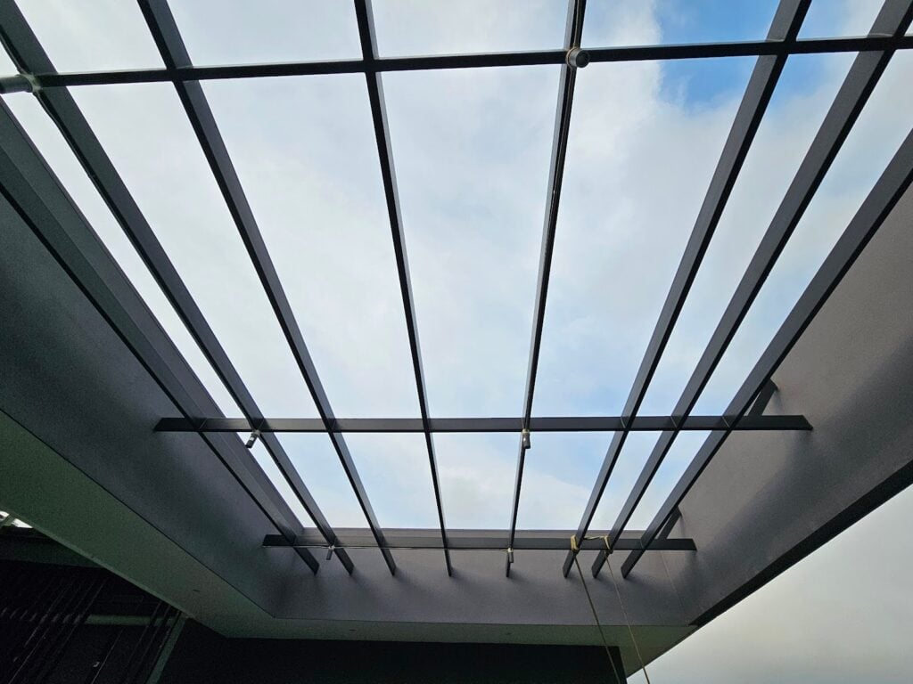 Contemporary Tube Steel Pergola providing shade on rooftop terrace