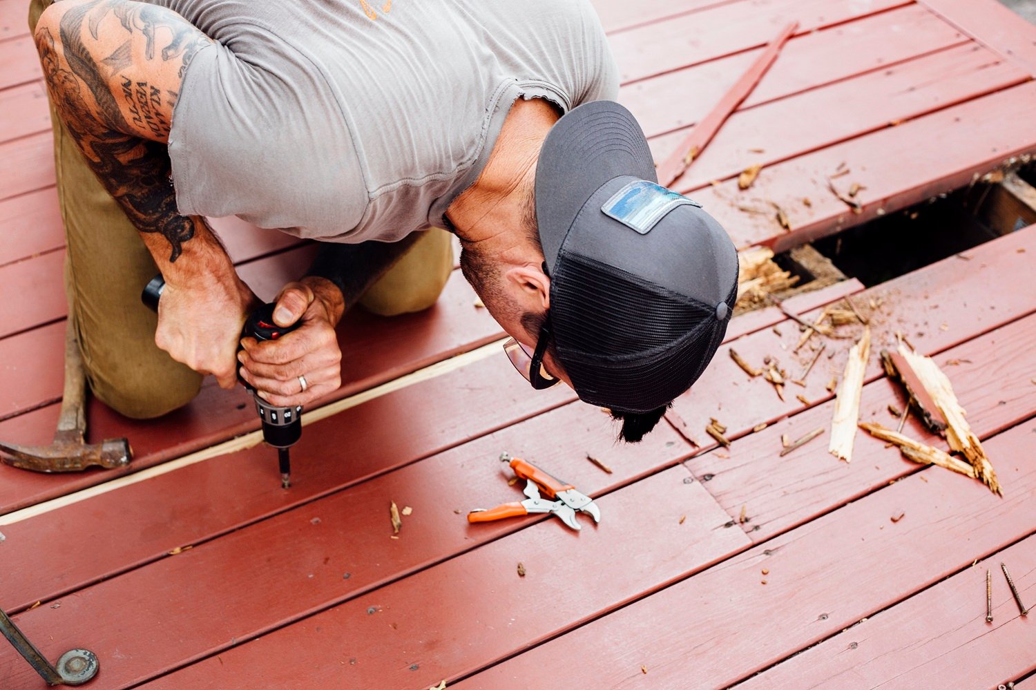 Expert deck builder in Washington DC constructing custom wood deck for residential home