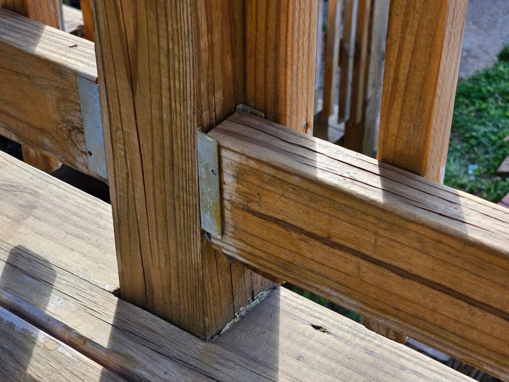 Deck framing reinforced with connector clips