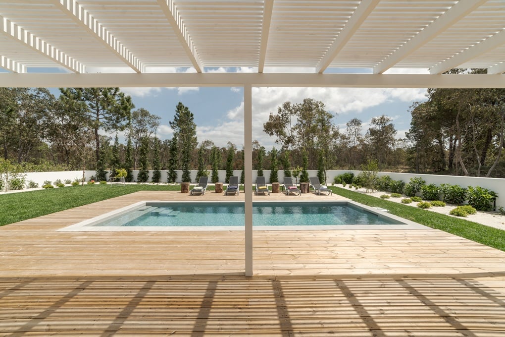 Luxury pool patio for Rockville homes with modern stone pavers and elegant outdoor seating