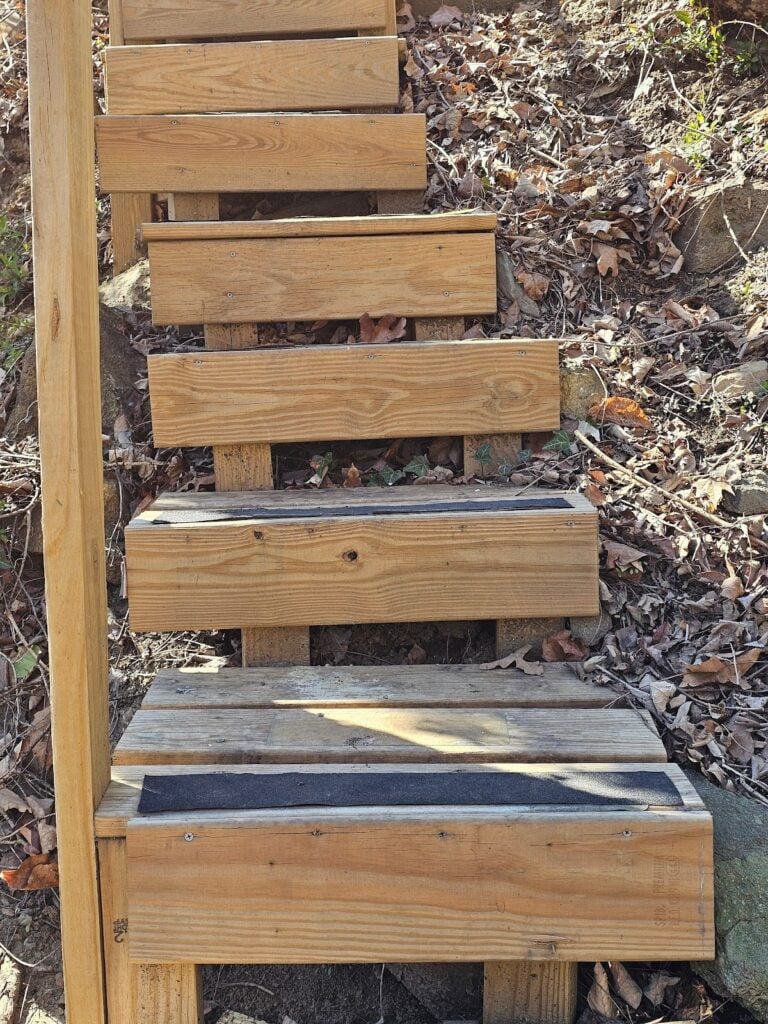 Outdoor deck featuring beautifully crafted wooden steps