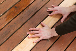 Homeowner in Washington DC choosing best deck material between wood, composite, and PVC