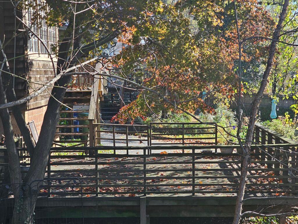 Low deck on a sloped yard with simple ground-level framing