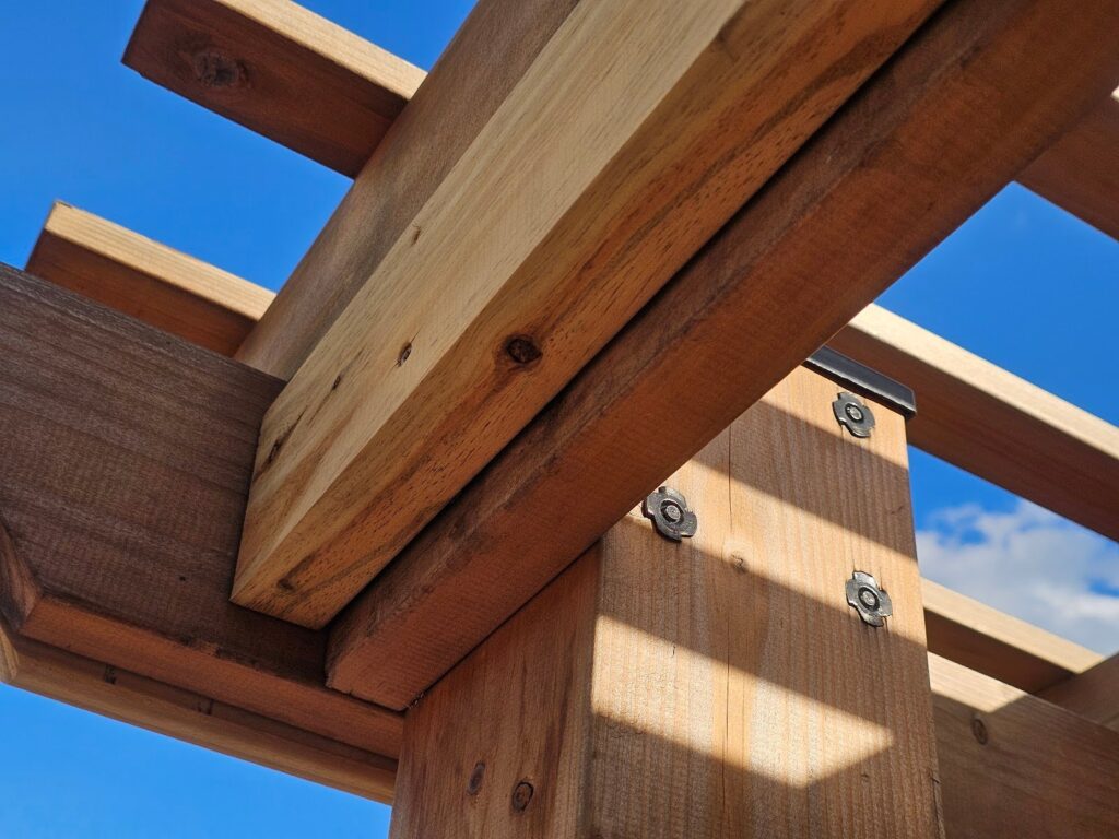 threaded toothed plates that allow for bolting through the the lumber frame