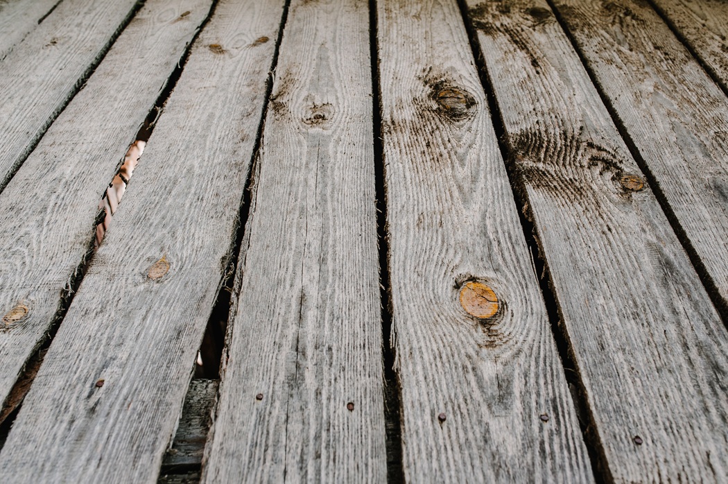 Old unsafe wooden deck in Gaithersburg showing structural wear and loose railings before replacement