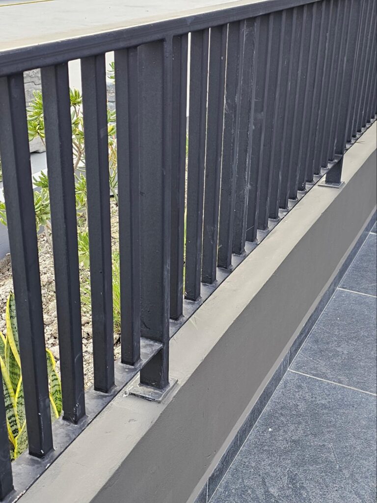 Steel Guardrail on a Kneewall 3 typical solid thinner half inch steel bars