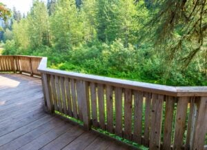 Wooden deck railing affected by rain and humidity in Washington DC