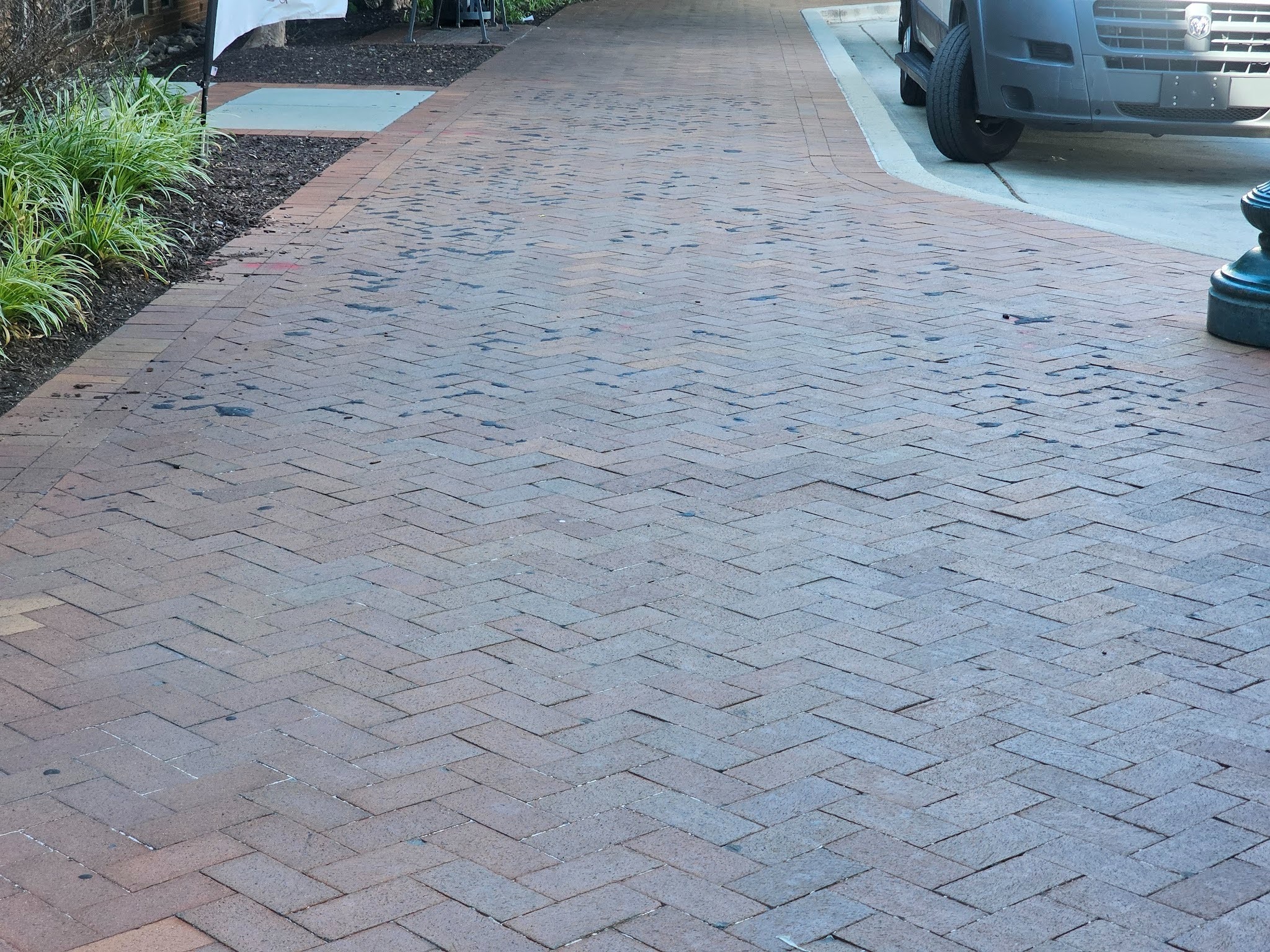 Asphalt Melting though Brick Paving - Part II 2 Brick paving affected by asphalt migration and pavement deterioration