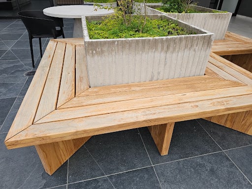 Built-in bench seating surrounding a patio planter box