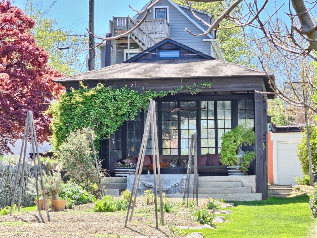 Outdoor covered patio featuring comfortable seating and a sheltered design